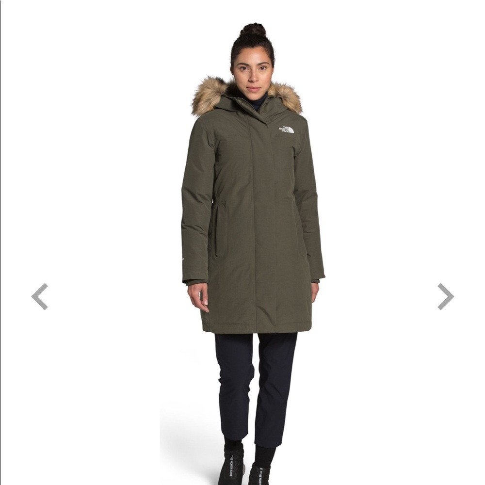 Taupe green north face puffer jacket with furry hood.
